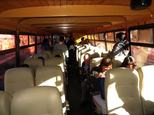 RIDE ECUADOR BY TRAIN, RAIL, RAILROAD & RAILWAY: Interior of a restored bus-train on train wheels.