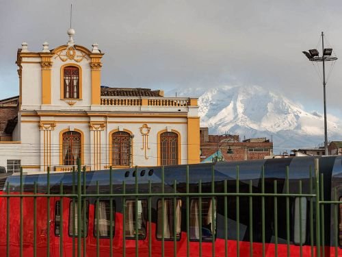 RIDE ECUADOR BY TRAIN, RAIL, RAILROAD & RAILWAY: The renovated Riobamba railway station with the Chimborazo in the background. 