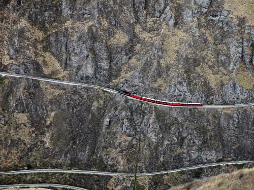 RIDE ECUADOR BY TRAIN, RAIL, RAILROAD & RAILWAY: The Crucero train switchbacks down the Andes slopes at the Nariz del Diablo or Devil's Nose passage. 