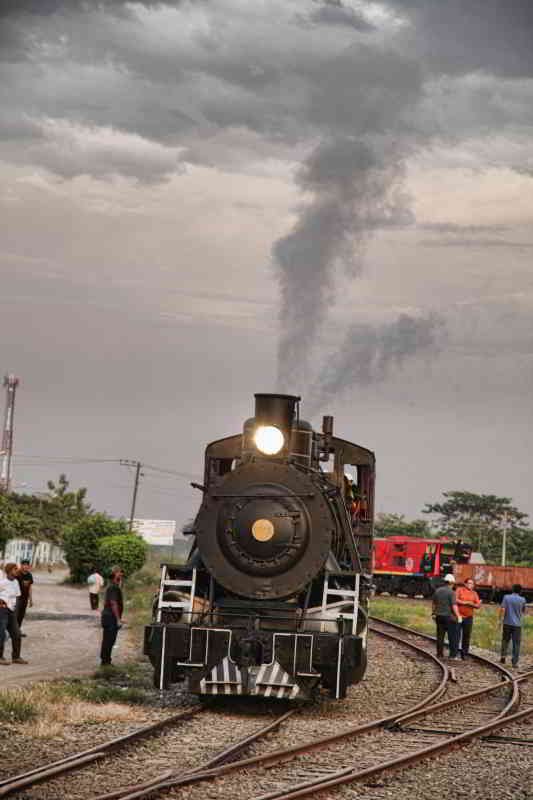 RIDE ECUADOR BY TRAIN, RAIL, RAILROAD & RAILWAY: Steam engine preparing for departure at Chambacalle Railroad station in Quito.