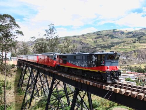 ECUADOR TRAIN SYSTEM: Crucero Train crossing a bridge in the coastal lowlands.